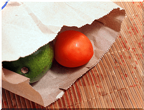 An avocado in kraft paper