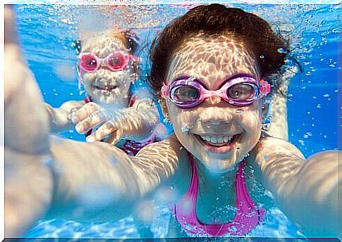 Children learning to swim